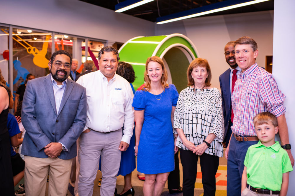 PMF Board Members in front of the Bodyworks exhibit